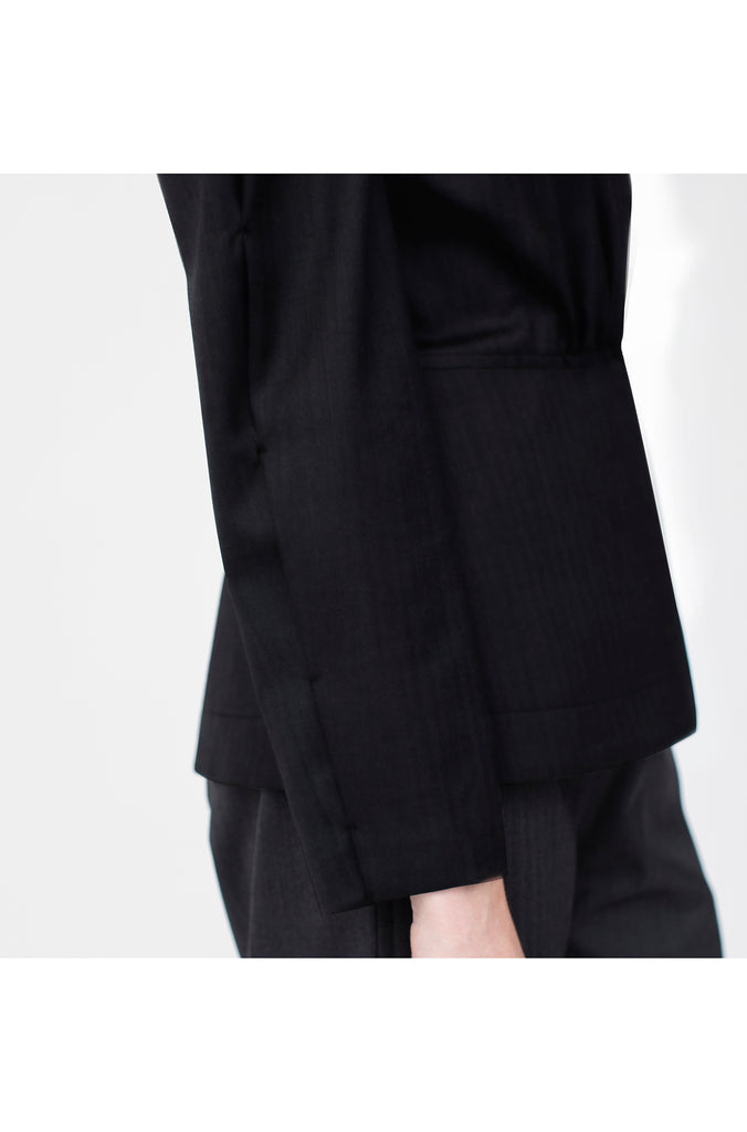 The Power sleeve top in black fine wool from Savile Row