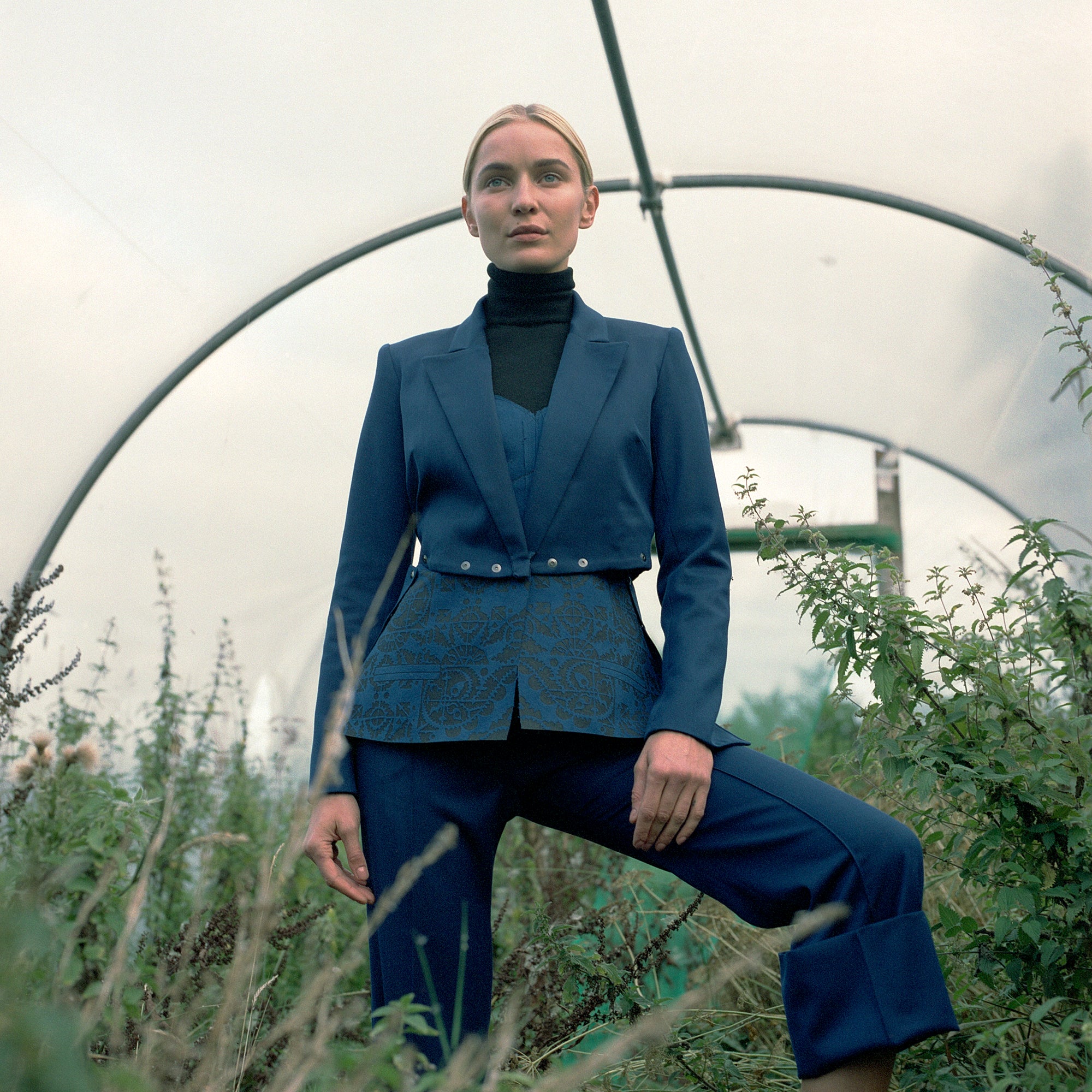 Popper jacket with laser cut peplum in blue luxury worsted wool & faux engraved suede